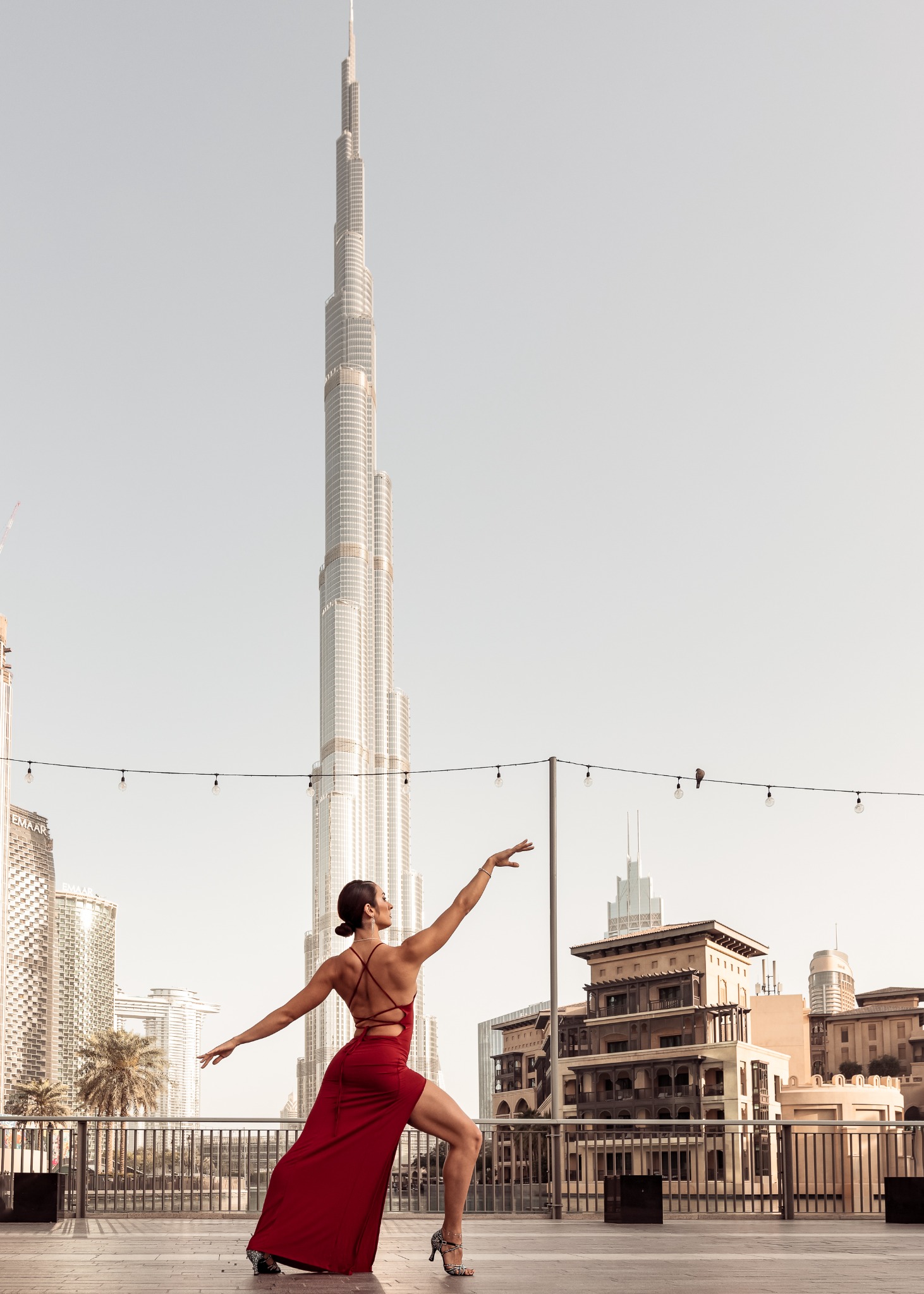 Dancer performing with the Burj Khalifa in the background