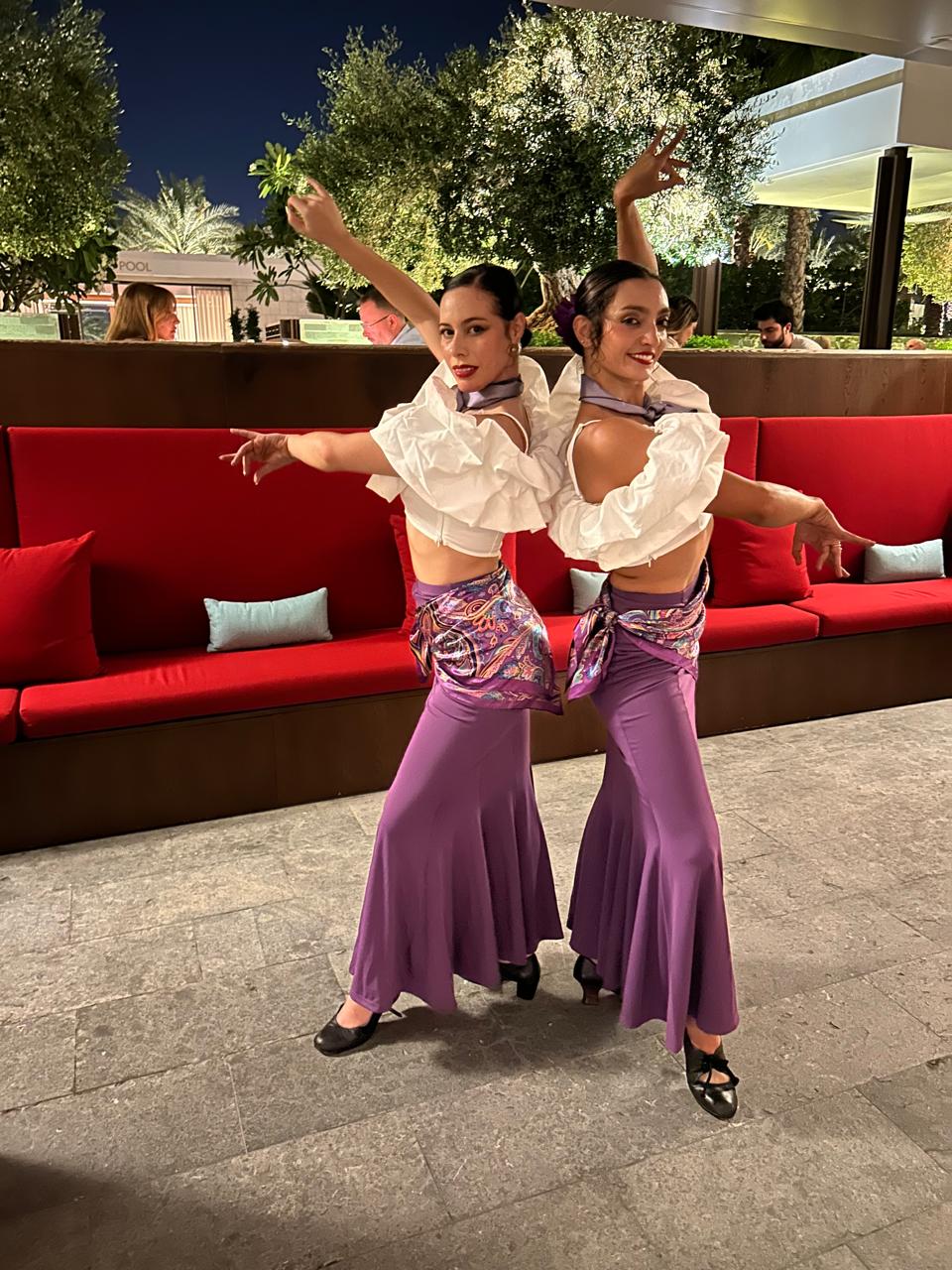 Latin dance duo in colorful costumes